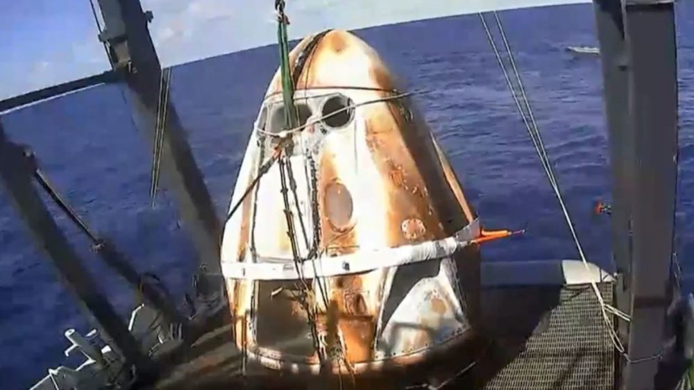 The Crew Dragon capsule was fished out of the Atlantic Ocean off the Florida coast shortly before 10 a.m. ET Friday, with its surface bearing the scorch marks of its fiery re-entry.