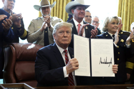 President Donald Trump speaks about border security in the Oval Office of the White House, Friday, March 15, 2019, in Washington. Trump issued the first veto of his presidency, overruling Congress to protect his emergency declaration for border wall funding.