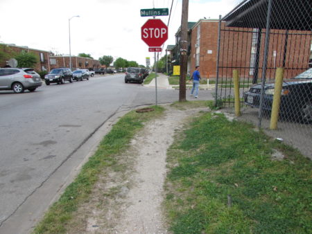 Because there's no sidewalk, pedestrians created this dirt path at Dashwood and Mullins.