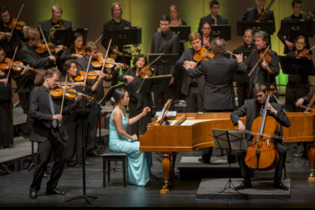 Shows musicians from the concert in the featured recording