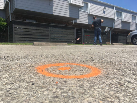 Spray paint marks the spot at a Houston-area apartment complex in Baytown, Texas, Tuesday, May 14 ,2019, where police say an officer shot and killed a woman after she hit him with his Taser during a struggle, shocking him. Police Lt. Steve Dorris said Tuesday that the officer shot at Pamela Turner after she hit him in the groin with the Taser. Dorris said Turner did not fire the stun gun but it shocked the officer when it struck him. Turner was pronounced dead at the scene. (AP Photo/John Mone)
