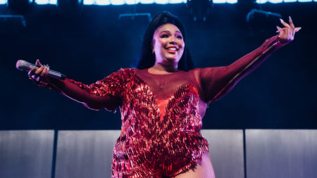 Lizzo performs onstage at Coachella on April 21 in Indio, Calif. The flute-playing singer and rapper celebrates self-acceptance on her latest album, Cuz I Love You.