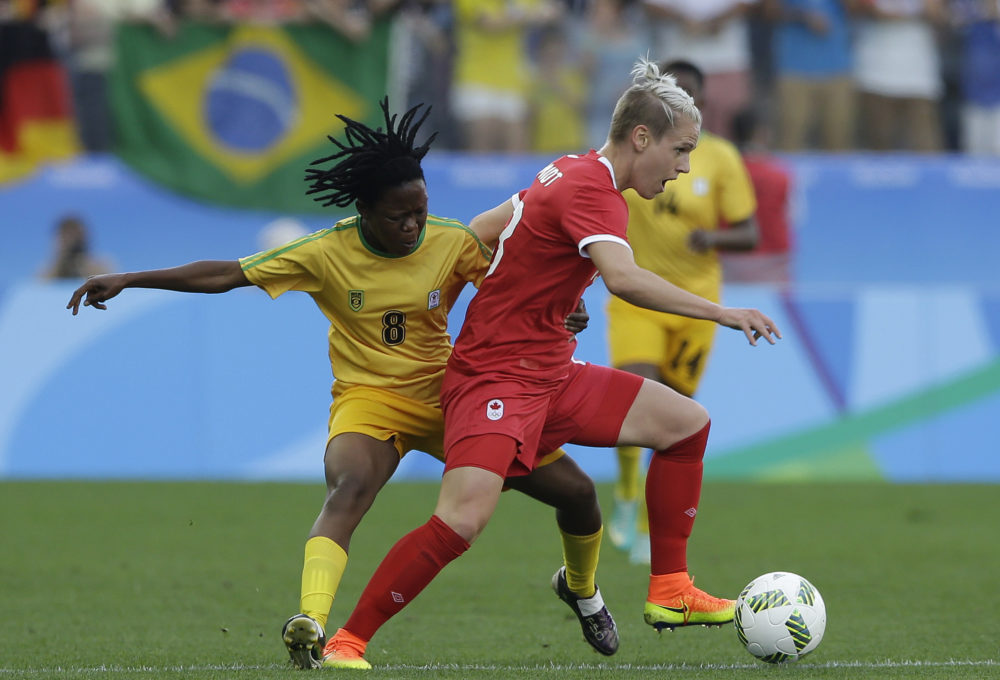 Canada's Sophie Schmidt controls the ball against Zimbabwe's Rejoice Kapfumvuti during a group B match of the women's Olympic football tournament between Canada and Zimbabwe in Sao Paulo, Brazil, Saturday, Aug. 6, 2016. (AP Photo/Nelson Antoine)