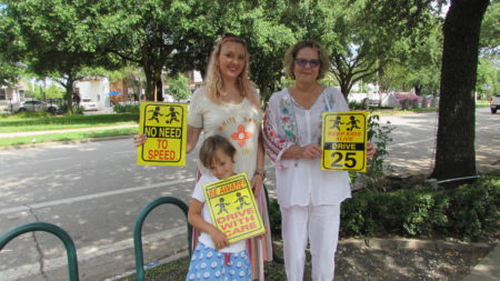 Heights neighbors Jolene Tollett (left) and Leann Mueller. In front is Tollett's six-year-old daughter, Eve McDermott.