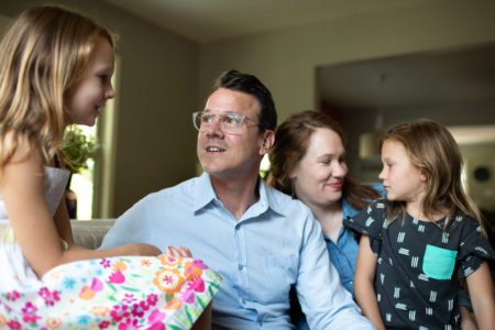 A new Texas law aims to protect patients like Drew Calver, pictured here with his wife, Erin, and daughters, Eleanor (left) and Emory, in their Austin, Texas, home. After being treated for a heart attack in April 2017, Calver, a high school history teacher, got a surprise medical bill for $108,951.