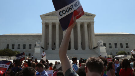 People gather in front of the U.S. Supreme Court last week, some opposing the controversial citizenship question the Trump administration tried to add to the 2020 census.