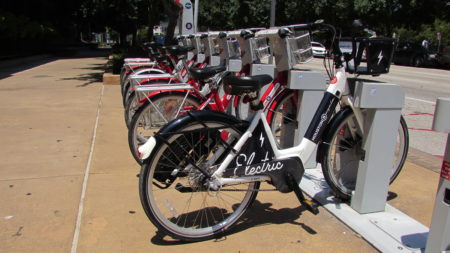 Houston BCycle has deployed four electric bikes as part of a pilot program.