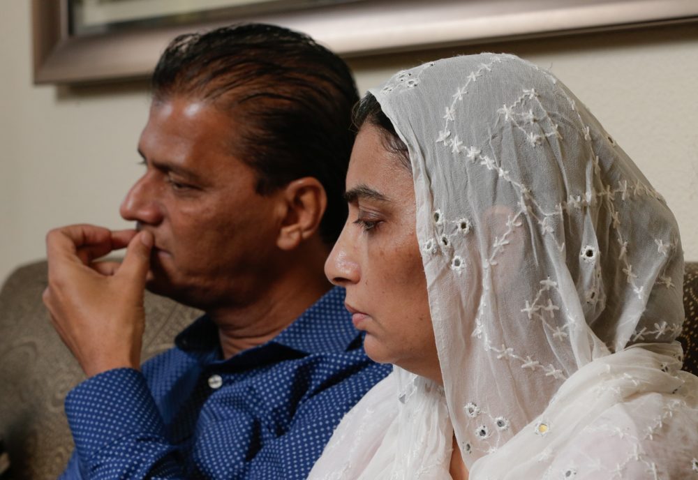 In this Wednesday July 10, 2019 photo, Abdul Aziz, left, and his wife Farah Naz, the parents of Santa Fe High School shooting victim Sabika Aziz Sheikh, 17,  talk about the impact of Sabika's death during an interview at their home in Houston.