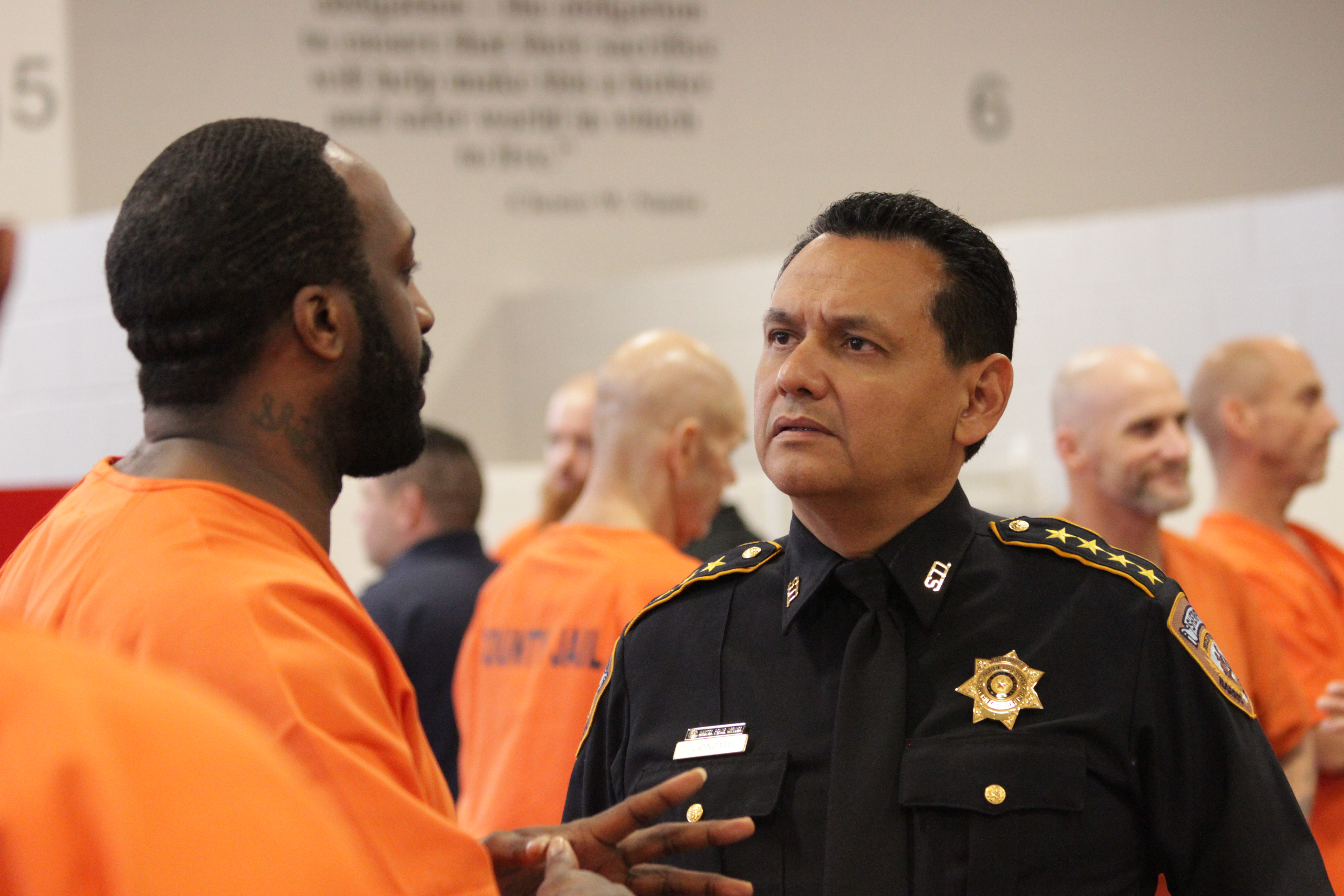 Sheriff Ed Gonzalez talks to an incarcerated person at the downtown Harris County jail in July.