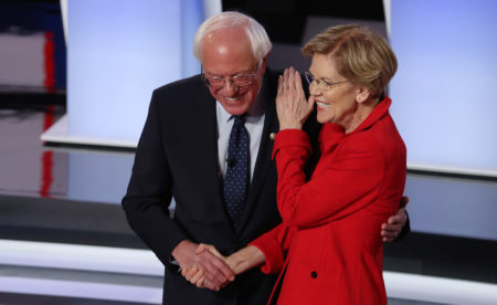Sanders and Warren greet each other at the start of Tuesday night's debate.