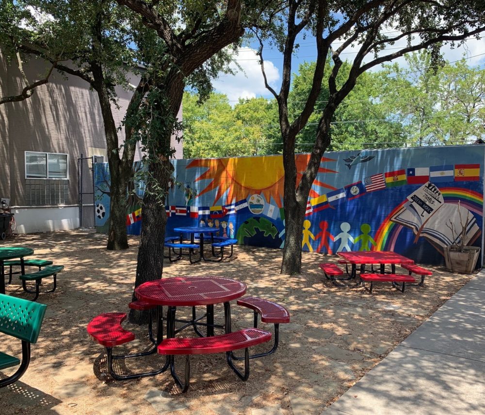 When the weather is cool enough, migrant kids have recreational time to play soccer or hang out in an enclosed outdoor space.
