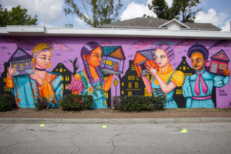 The "Bringing Home with Us" mural, is located in Houston's Sixth Ward. It's part of a series presented by Arts District Houston.