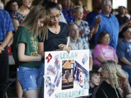 High School students Celeste Lujan, left, and Yasmin Natera mourn their friend, Leila Hernandez, one of the victims of the Saturday shooting in Odessa, Texas, at a memorial service on Sunday.