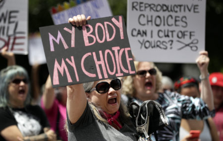 A group gathers to protest abortion restrictions at the State Capitol in Austin, Texas in May 2019. Arguments over a Texas law requiring that health care clinics bury or cremate fetal remains from abortions and miscarriages are set for a federal appeals court in New Orleans.