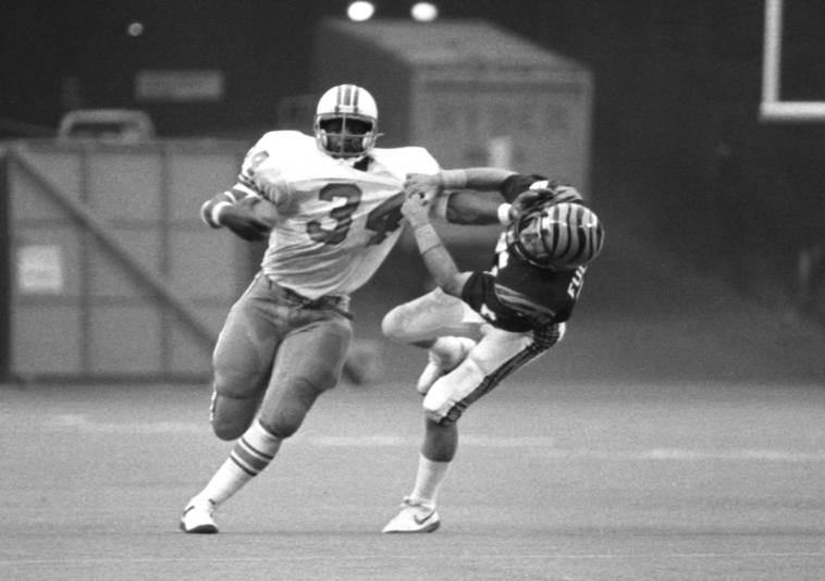 Football running back Earl Campbell poses in his Houston Oilers