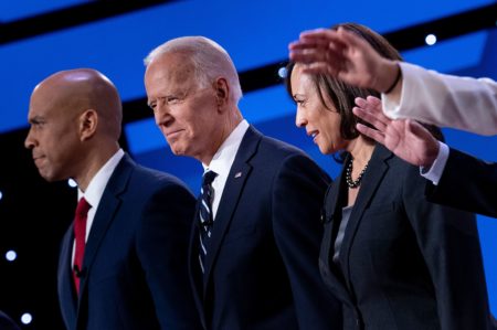 Democratic presidential hopefuls (from left): Sen. Cory Booker, D-N.J., former Vice President Joe Biden, and Sen. Kamala Harris, D-Calif., onstage before the July debate.