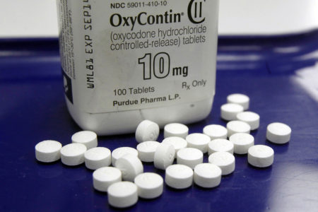 This Feb. 19, 2013, file photo shows OxyContin pills arranged for a photo at a pharmacy in Montpelier, Vt. Purdue, the maker of OxyContin, is facing about 2,500 lawsuits seeking to hold it accountable for the opioid crisis, which has killed more than 400,000 people in the U.S. since 2000.