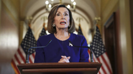 House Speaker Nancy Pelosi reads a statement announcing a formal impeachment inquiry into President Trump on Capitol Hill.