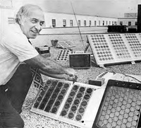 Elliot Berman tests solar arrays on the roof of Solar Power Corp.'s offices.