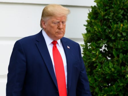 A federal judge in New York issued an injunction Friday against a Trump Administration rule that would make it harder for low-income immigrants to get a green card. Trump is seen here leaving the White House last week.