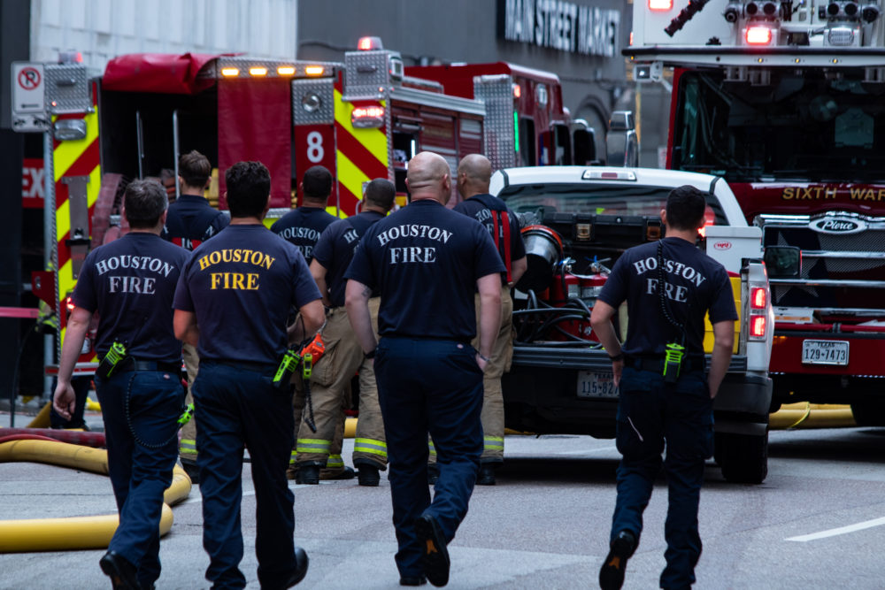 Houston firefighters line up to get first checks in backpay settlement ...