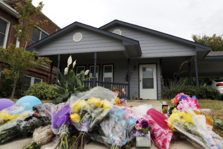 In this Oct. 15, 2019, photo, a makeshift memorial rests on the sidewalk that leads to the home of Atatiana Jefferson in Fort Worth, Texas. Former Fort Worth Police officer Aaron Dean shot Jefferson, through a back window around 2:30 a.m. after a neighbor reported her front door was left open.