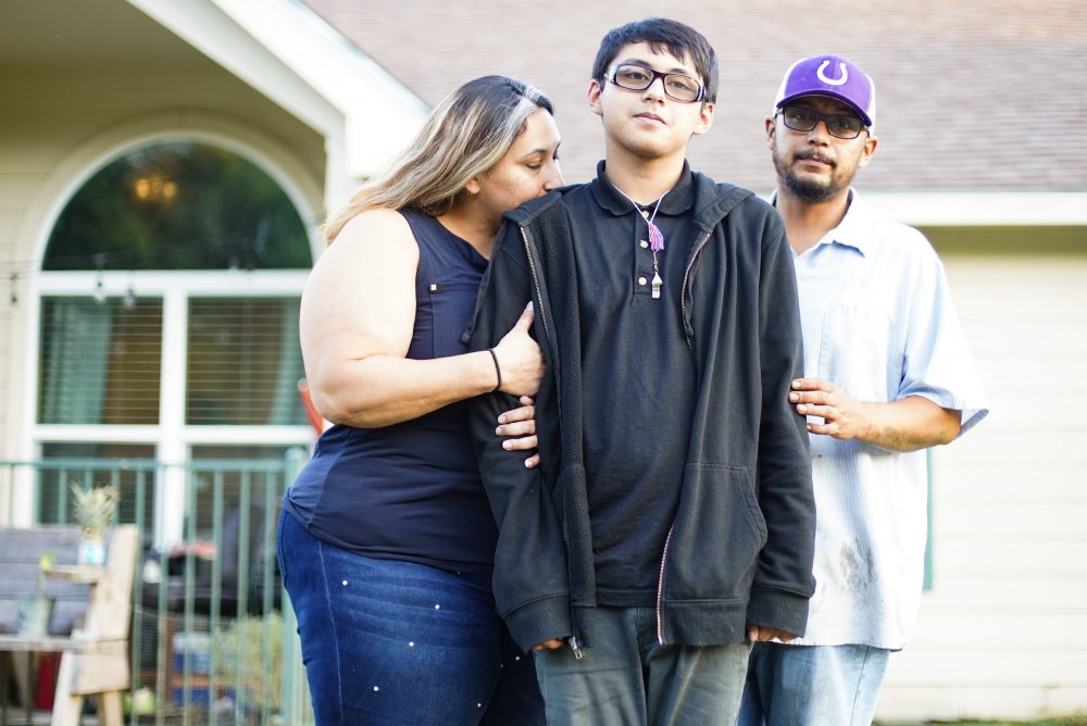Xavier Castro outside his home with his parents in Dayton. After switching school districts, the family struggled to get Xavier the help he needed to succeed in school.
