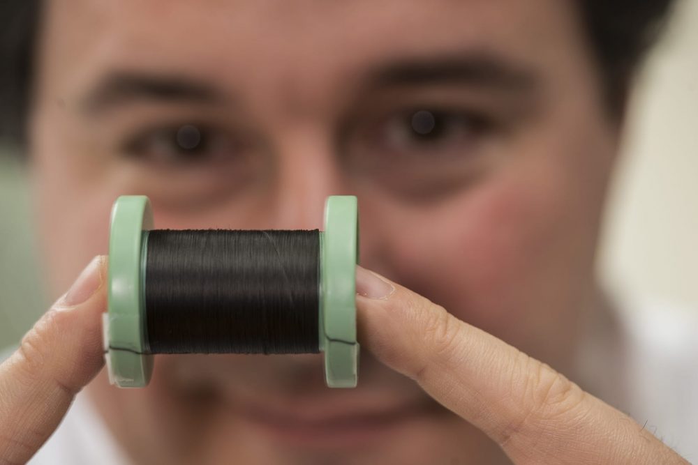 Matteo Pasquali, director of Rice University's Carbon Hub, with a spool of fiber made of pure carbon nanotubes. 