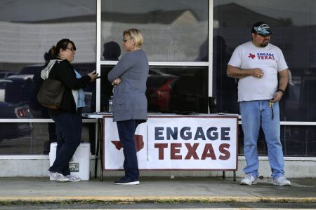 Canvassers with Engage Texas, a political super PAC, seek to sign up voters while set up outside a driver's license office in San Antonio. With their base not expanding and their margins of victory getting thinner, Texas Republicans have begun spending big on finding more conservatives to vote.