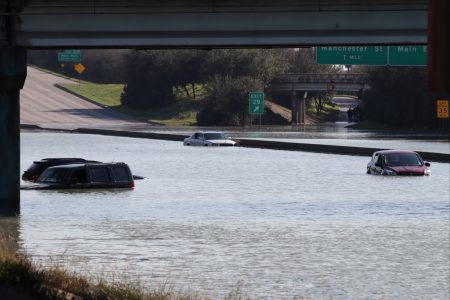 Cars are stuck in floodwater on the East Loop Thursday.