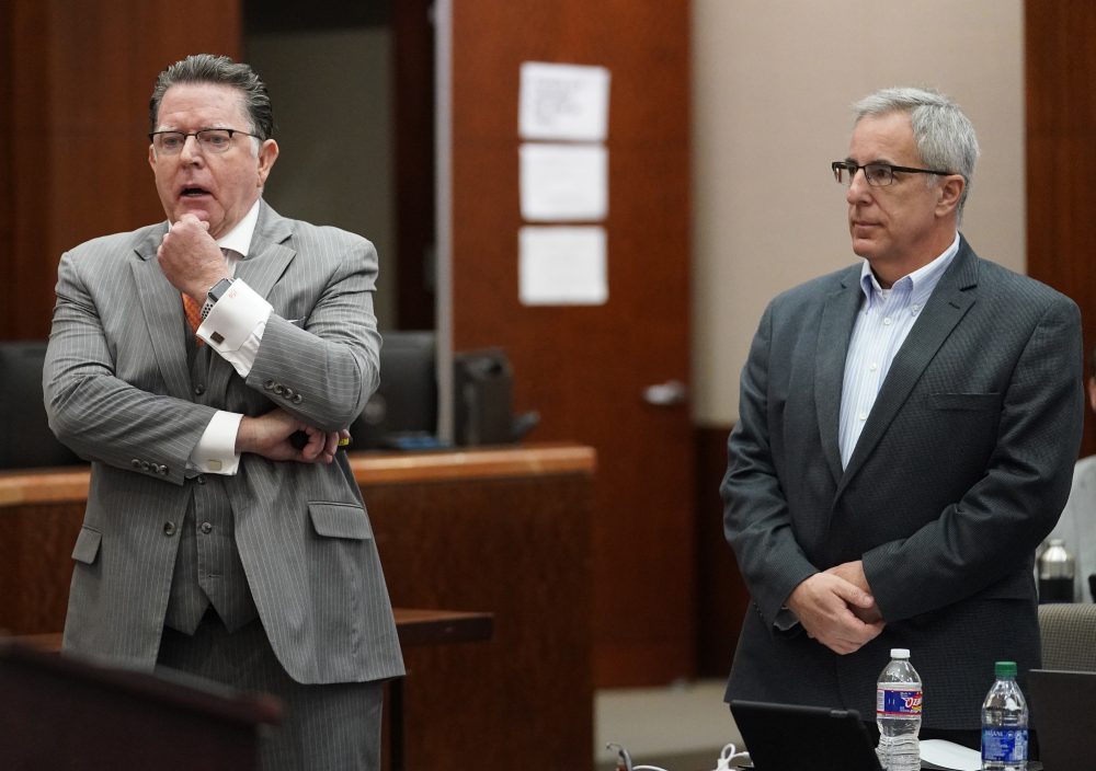 Dan Cogdell, defense attorney, left, speaks about his client, Michael Keough, retired vice president of Arkema Inc., right, during the Arkema Inc. criminal trial Monday,