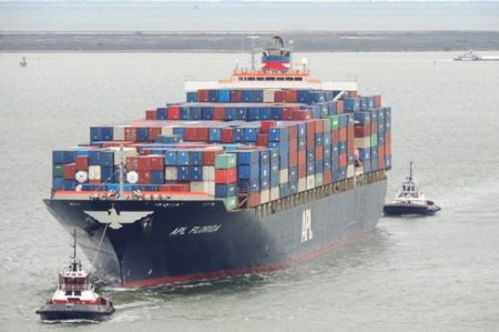 A ship loaded with containers enters the Port of Houston.
