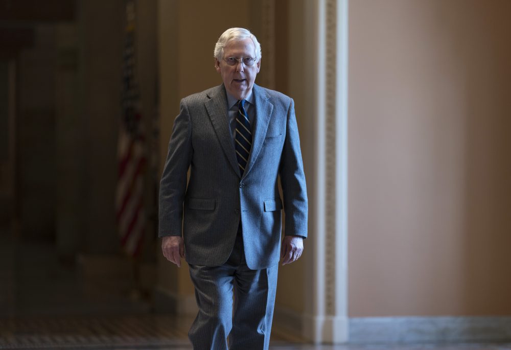 Senate Majority Leader Mitch McConnell, R-Ky., walks to the chamber for a vote on a measure to help tackle the coronavirus outbreak on Capitol Hill in Washington, Thursday, March 5, 2020.