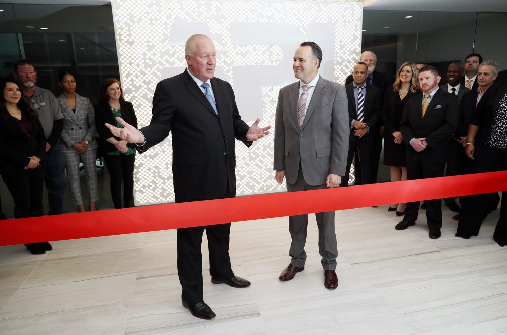 American Petroleum Institute President and CEO Mike Sommers, right, and North America's Building Trades Unions President Sean McGarvey, left, cut the ribbon on API's new headquarters Feb. 14 in Washington.