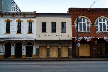 Bars are shuttered on Austin's Sixth Street during the COVID-19 pandemic.