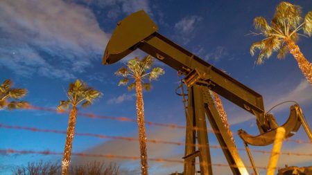 Pump jacks draw crude oil near Long Beach, Calif., on March 9. A U.S. crude oil benchmark has hit record lows.