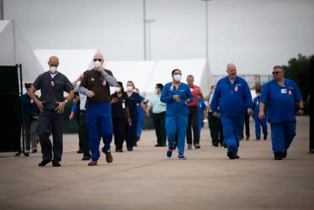 Medical personnel during a media tour of a medical shelter at NRG Park in Houston on April 11, 2020. The facility was built in less than a week for a possible overflow of COVID-19 cases in the Houston area.