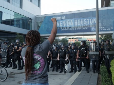A protester in downtown Houston faces down police on June 2, 2020.