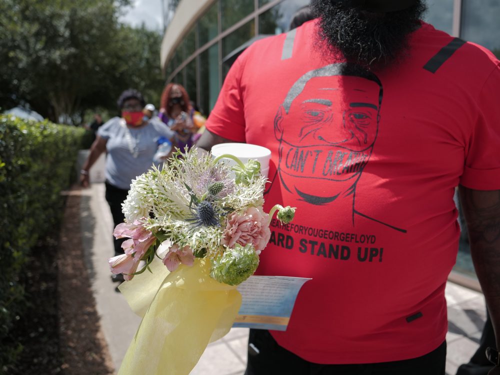 Mourners attend George Floyd's memorial in Houston, on Monday, June 8, 2020.