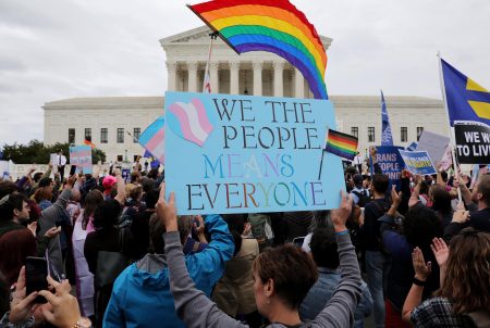 LGBTQ activists and supporters hold a rally outside the U.S. Supreme in Washington on October 8, 2019.