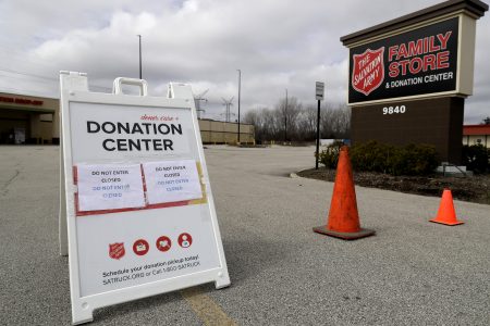 In this April 1, 2020 file photo, a closed sign is displayed outside a Salvation Army store and donation center in Glenview, Ill. Across the country, drug and alcohol recovery programs claiming to help the poor and the desperate are instead conscripting them into forms of indentured servitude, requiring them to work without pay or for pennies on the dollar, in exchange for their stay.