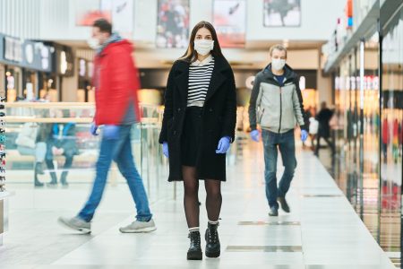 woman with face mask walking at public place. coronavirus infection epidemia outbreak