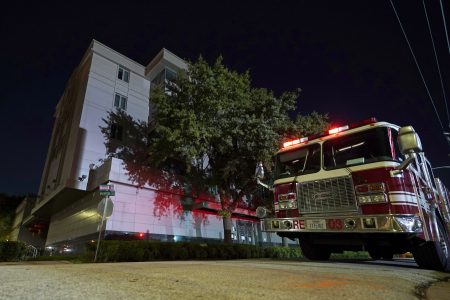 A firetruck is positioned outside the Chinese Consulate Wednesday, July 22, 2020, in Houston. Authorities responded to reports of a fire at the consulate. Witnesses said that people were burning paper in what appeared to be trash cans, according to police. China says the U.S. has ordered it to close its consulate in Houston in what it called a provocation that violates international law. (AP Photo/David J. Phillip)