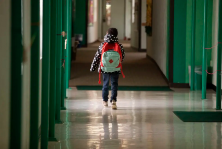 A student walks down the hallway at Cactus Elementary School in Cactus on Jan. 28, 2020.