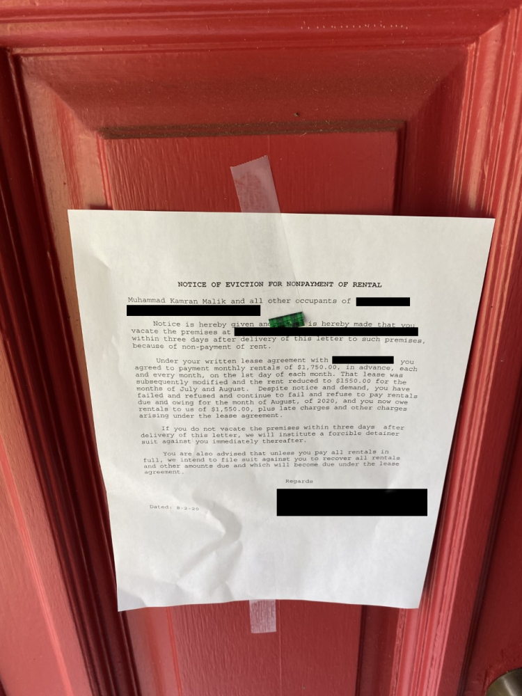 An eviction notice on the door of Kamran Malik, Aug. 2, 2020.