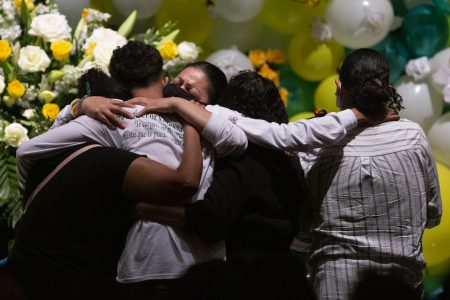 Alma García embraces Juan Cruz, the fiancé of Spec. Vanessa Guillén at her memorial service on Friday, Aug. 14, 2020, in Houston.