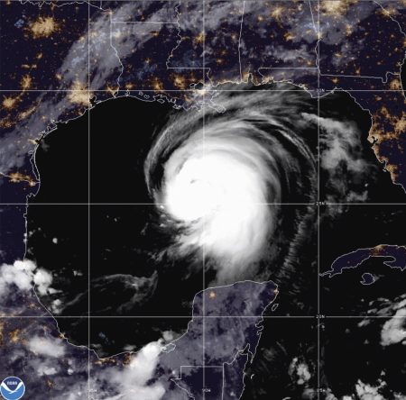 This satellite image released by the National Oceanic and Atmospheric Administration (NOAA) shows Hurricane Laura churning in the Gulf of Mexico, Wednesday, Aug. 26, 2020.  Forecasters say Laura is rapidly intensifying and will become a “catastrophic” Category 4 hurricane before landfall.