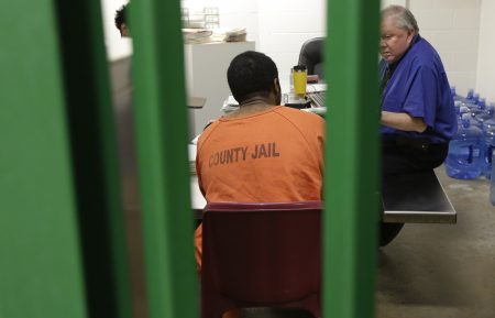 An man takes part in a therapy session in an acute unit of the mental heath unit at the Harris County jail, Friday, Aug. 15, 2014, in Houston.
