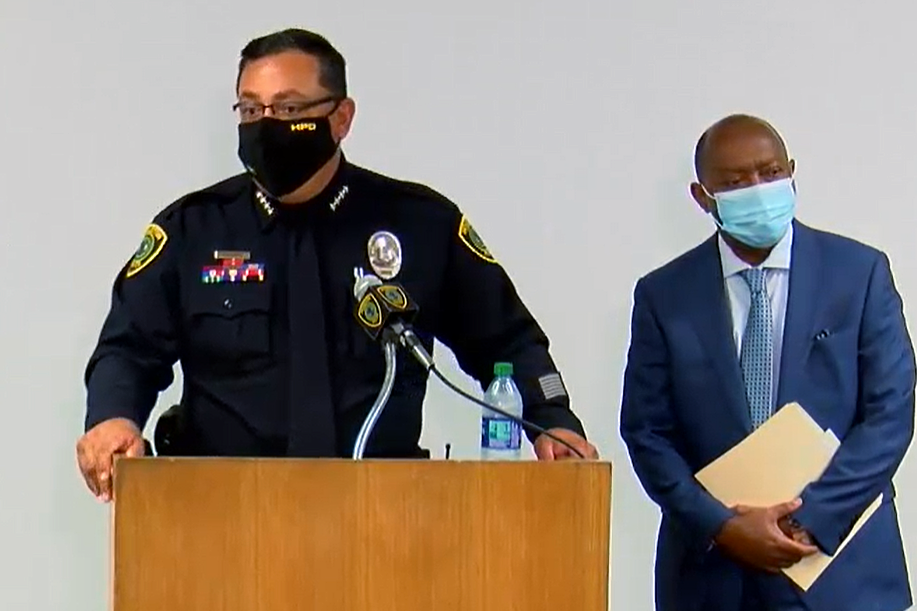 Houston Police Chief Art Acevedo announces the firing of four police officers over the shooting death of Nicolas Chavez, as Mayor Sylvester Turner looks on, at a Sept. 10, 2020 press conference.