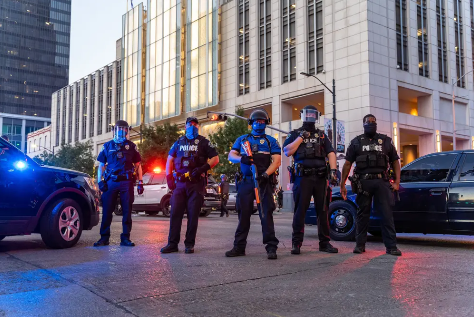 Protesters clash with police in riot gear in downtown Austin on Aug. 1. Calls to "defund police" during a revived nationwide movement calling for criminal justice reform have sparked an increasingly polarizing political debate. Gov. Greg Abbott has made the matter a campaign issue for 2020 candidates. 